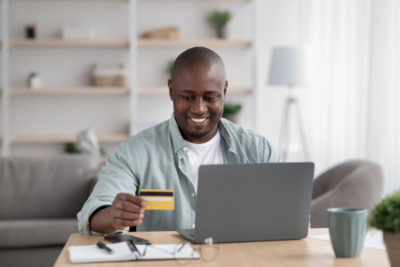 automate credit repair client onboarding process showing client completing online intake and payment on laptop using credit repair onboarding software and digital data intake system
