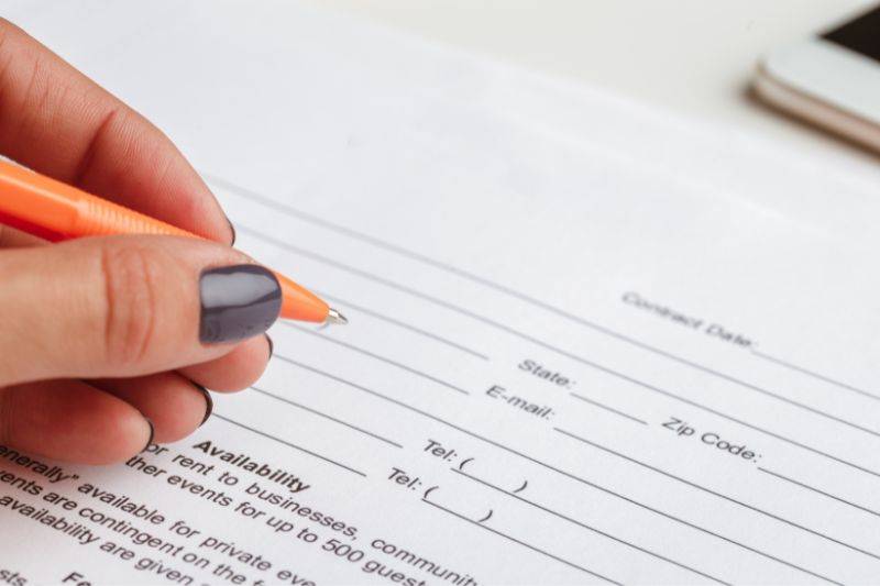 person filling out form representing CFPB complaint after public record dispute rejected on credit report