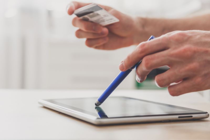 electronic signature platform for credit repair contracts showing client signing agreement on tablet with stylus for compliant credit repair e-signature contract onboarding