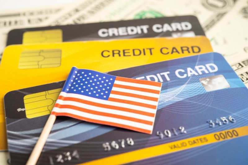 Credit cards with US flag representing federal laws like CROA and FCRA that regulate credit repair organizations in the United States