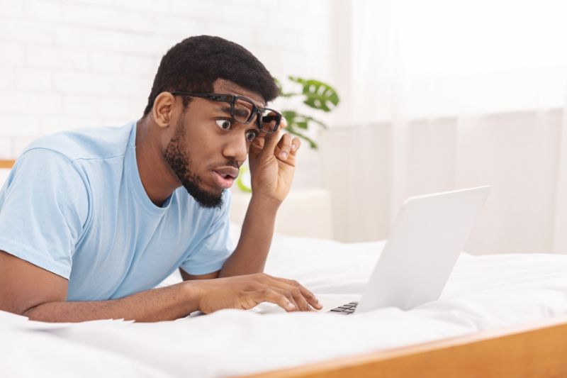Woman checking financial document and making a call about fraudulent or duplicate accounts on a credit report