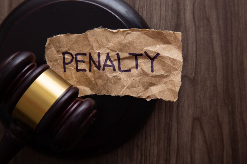State level penalties for credit repair law violations showing gavel and penalty sign, representing fines, civil lawsuits, and enforcement actions for credit repair companies