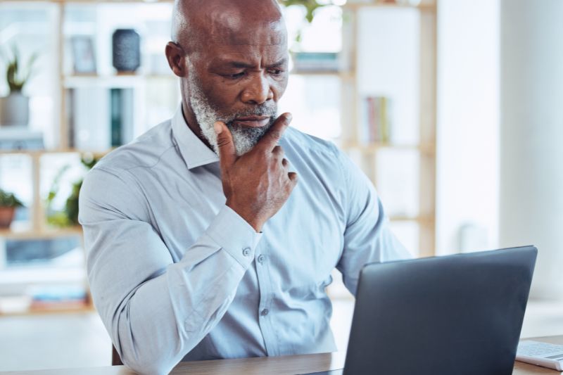 Credit repair business owner evaluating regulatory compliance, payment processing challenges, and risk factors associated with operating a credit repair business