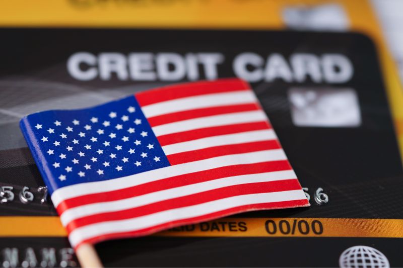 American flag on a credit card representing states that require bonding or registration for credit repair businesses.