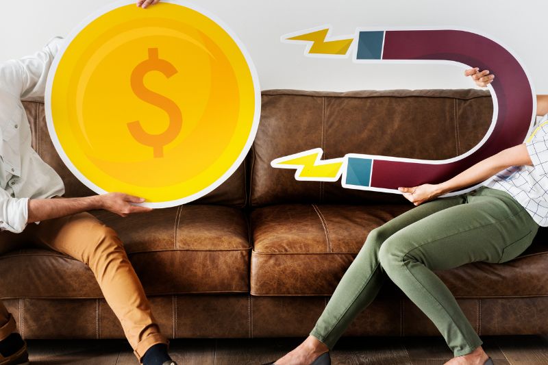 People holding money and magnet icons to represent third-party lead generation services for credit repair businesses and credit repair client acquisition.