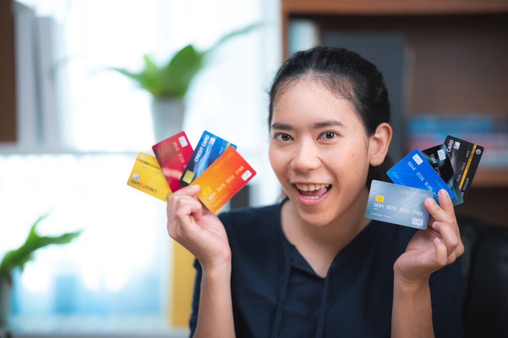Consumer reviewing multiple credit accounts representing a standard credit repair service package with three-bureau disputes, charge-off reviews, collection account disputes, and goodwill letter services
