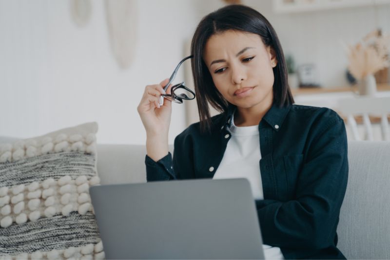 Business owner researching how to get clients for credit repair business while reviewing marketing and lead generation strategies