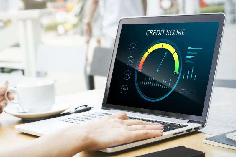 Credit repair software features displayed on a laptop, including credit report tracking, client management, dispute workflows, reporting, and progress monitoring.